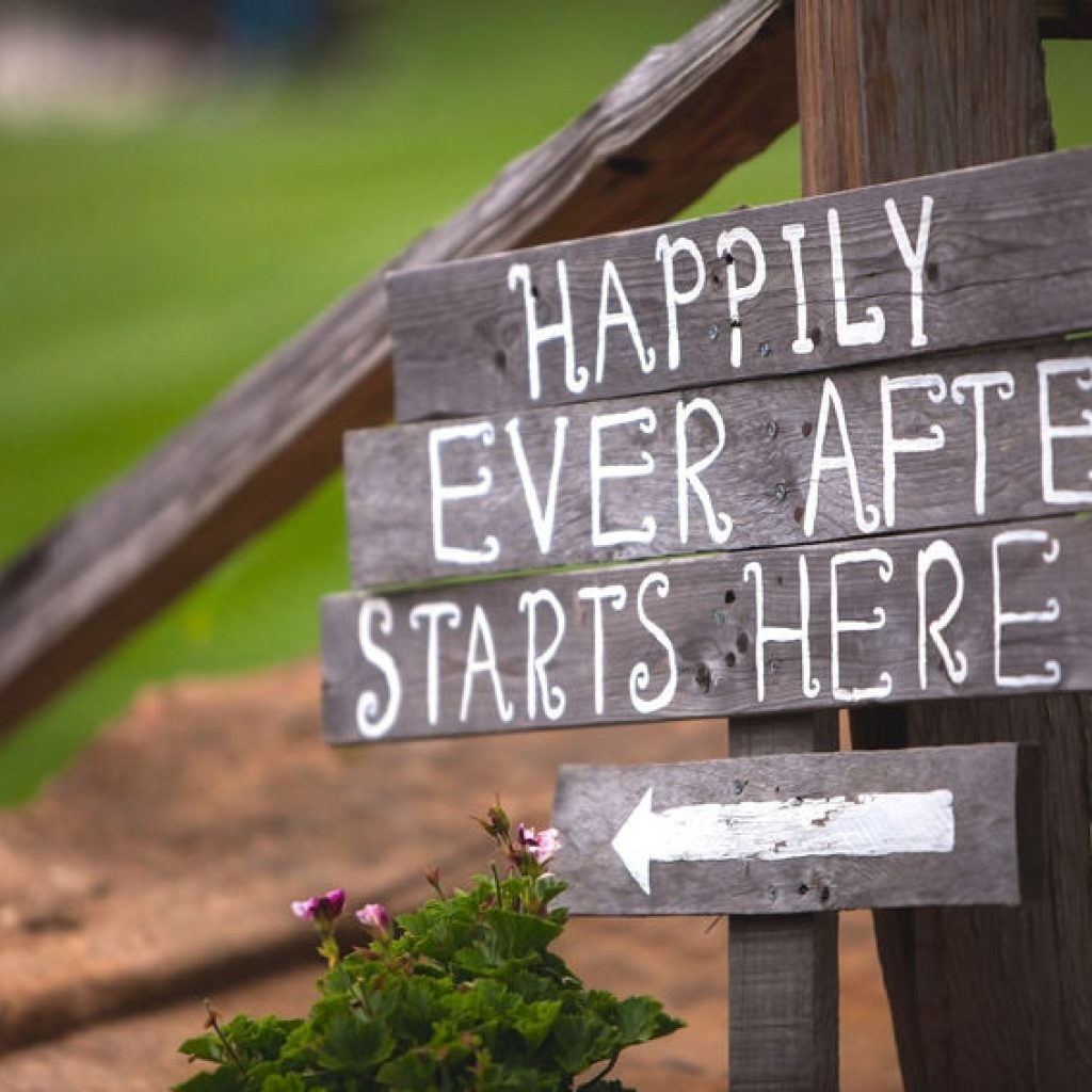 Happily Ever After Starts Here sign at wedding venue